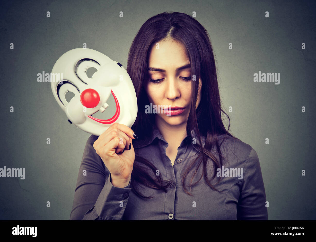 Asian business woman remove his other face mask. Changing mood concept  Stock Photo - Alamy