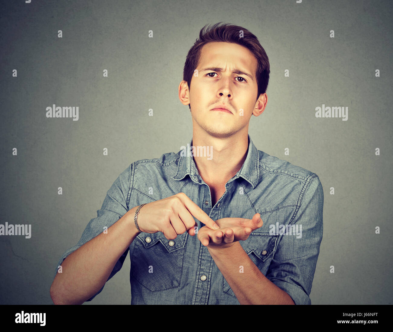 man asking for more money to pay back debt Stock Photo