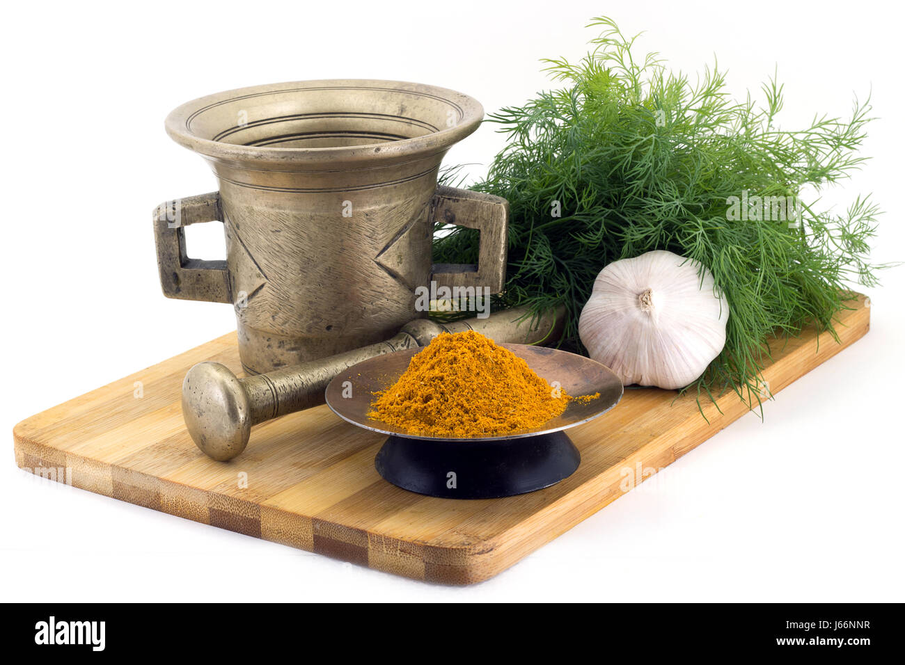 Still Life Spices, Immortin saffron ,marigold staminas in a copper vase on a wooden board on a background of a stern stupa for grinding spices, bunche Stock Photo