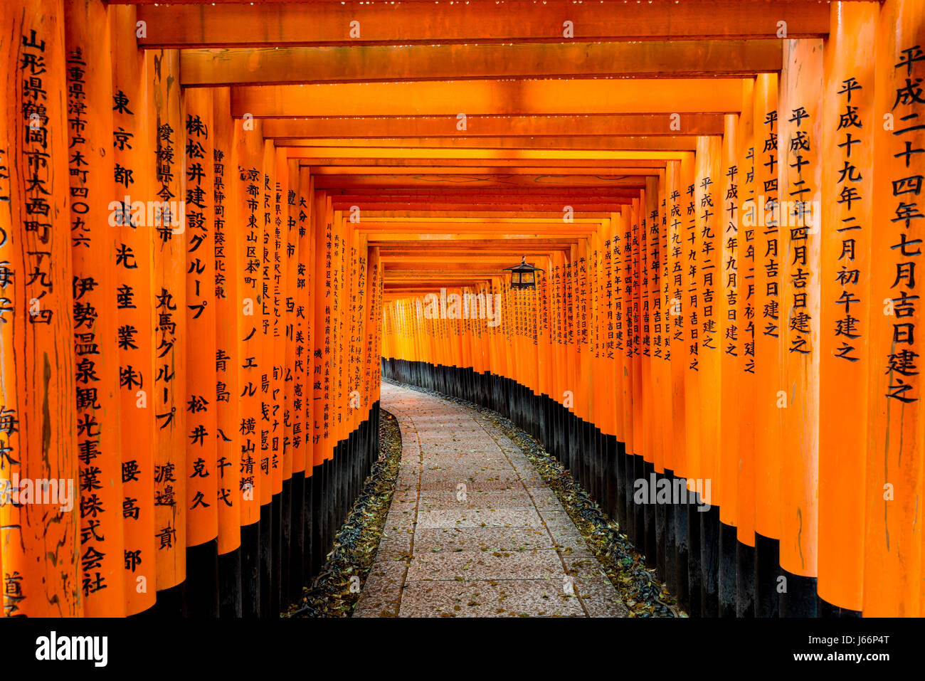 Red Tori Gate at Fushimi Inari Shrine in Kyoto, Japan. Stock Photo