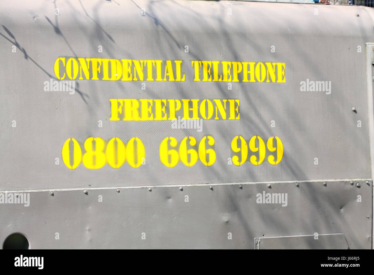 Confidential Telephone number stencilled on side of British miltary Land Rover used in Northern Ireland Stock Photo