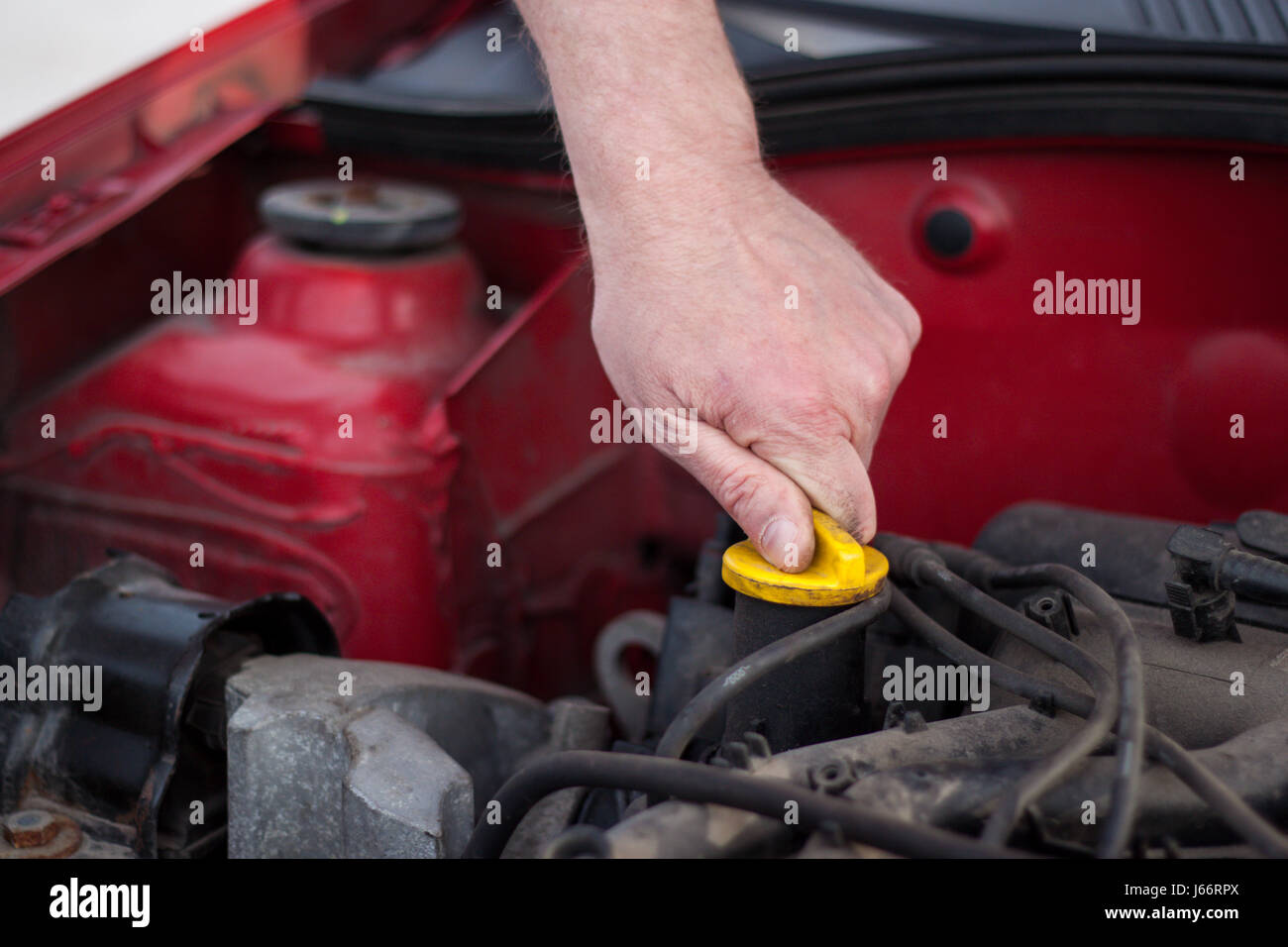 Raised the hood of the car, trying to master detects a failure, check