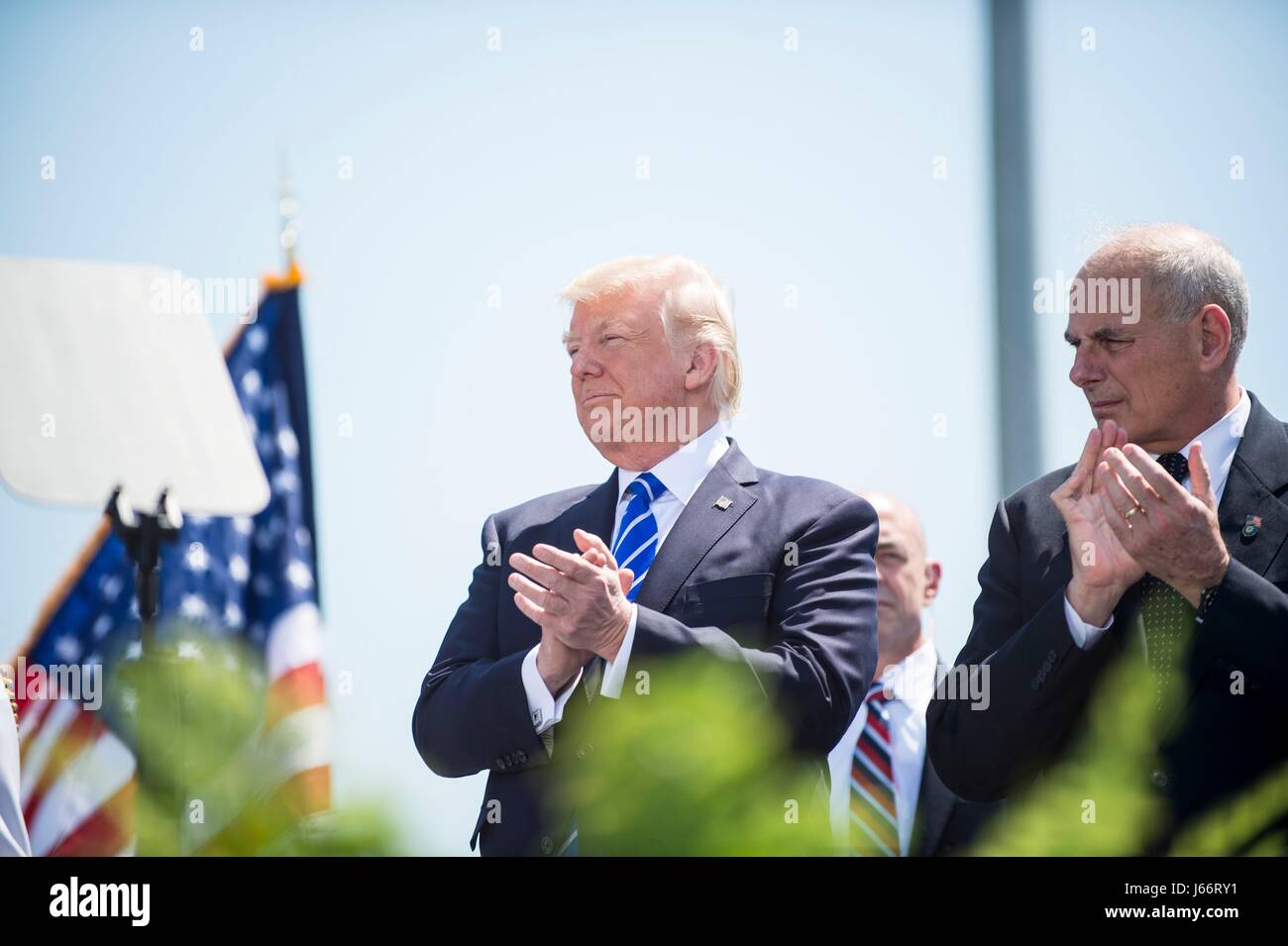 U.S. President Donald Trump and Homeland Security Secretary John Kelly applaud during the 136th Coast Guard Academy graduating class May 17, 2017 in New London, Connecticut. Stock Photo
