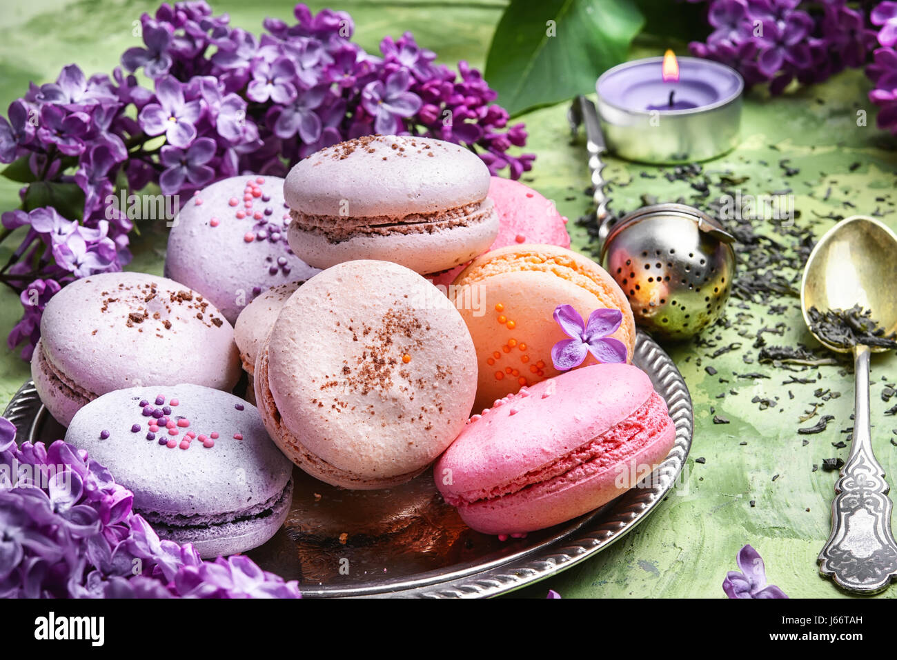 macarons cake and branch of springtime lilac blossoms Stock Photo - Alamy
