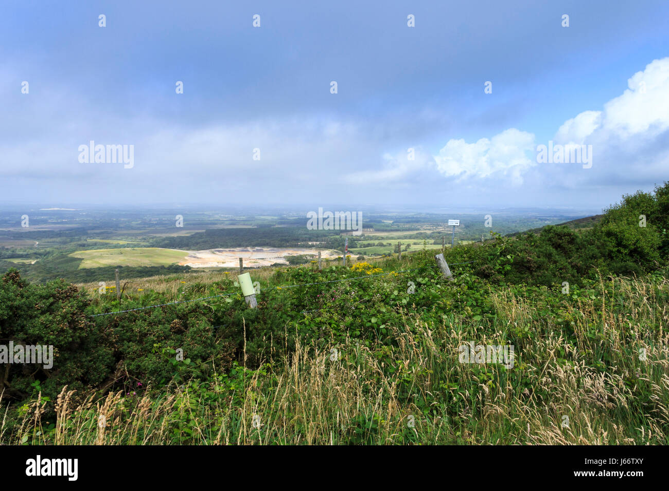 View inland from the South West coast path, Dorset, UK, across heathland and the army firing ranges Stock Photo