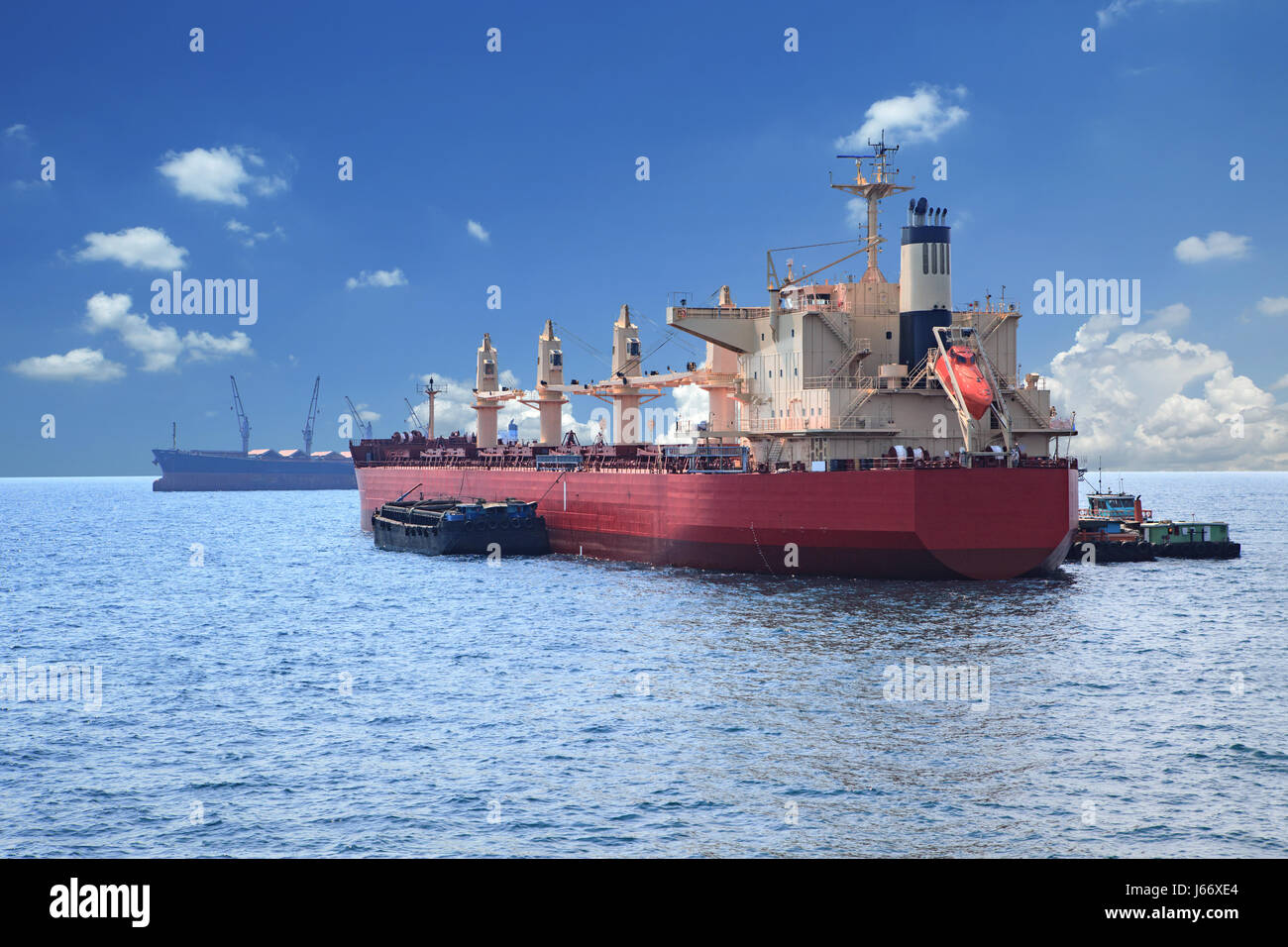 container boat loading goods over clear blue water sea use for vessel ...