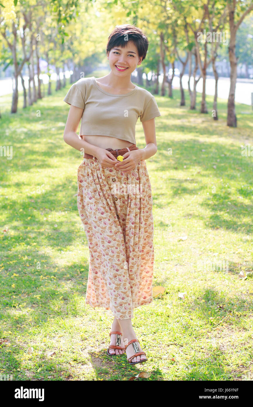 portrait of beautiful asian young woman with smiling face standing in ...