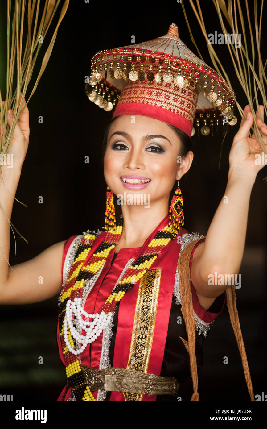 Bidayu woman strikes a pose for the camera with a beautiful portrait of this elegant lady of the Borneo Dayak ethnic minority group in Sarawak Stock Photo
