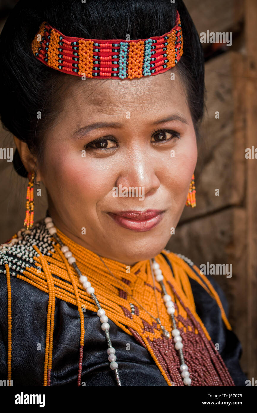 Close-up portrait image of Indigenous ethnic woman of Torajan culture dressed in traditional ceremonial costume for an event in Tana Toraja, Sulawesi Stock Photo