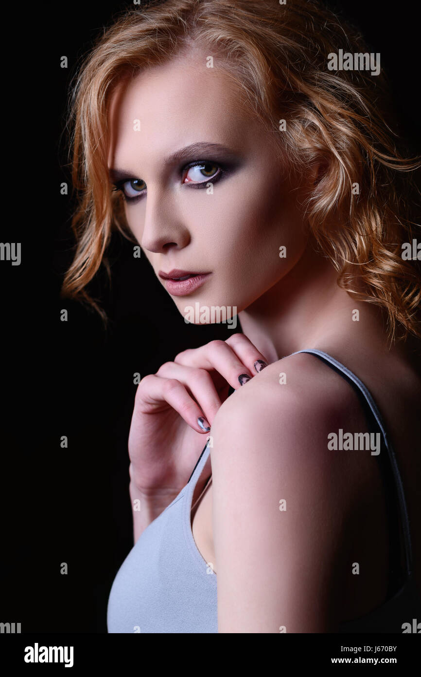 Closeup portrait of a beautiful young girl on a black background Stock ...
