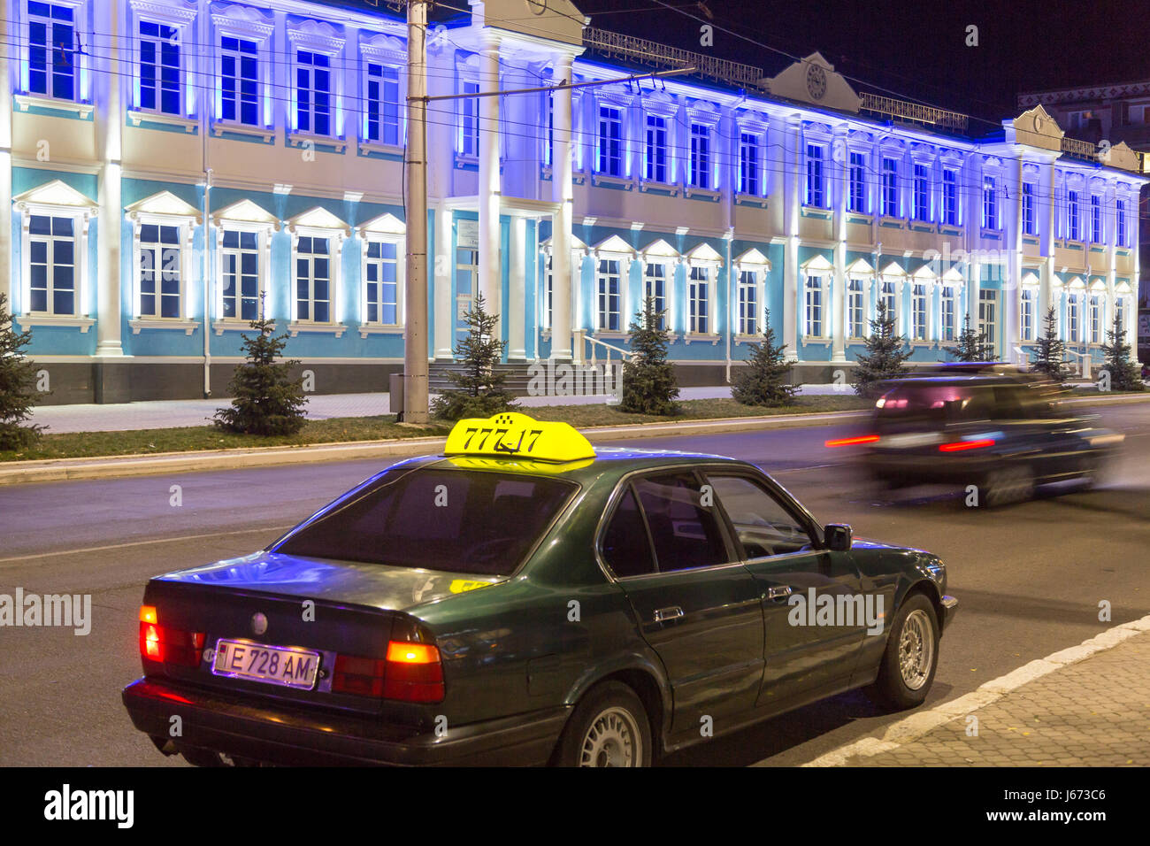 24.08.2016, Moldova, Transnistria, Tiraspol - Taxi on the central main street of the 25th October. Other street: the medical center. Transnistria is a repulsive Moldovan republic under Russian influence east of the river Dnister. The region split from Moldova in 1992 and is not recognized by any other country. Even the Russian-dependent entity is known as the Transdnestrovian Moldavian Republic (Pridnestrovkaja Moldavskaja Respublika / PMR). Tiraspol is the capital. 00A160824D416CAROEX.JPG - NOT for SALE in G E R M A N Y, A U S T R I A, S W I T Z E R L A N D [MODEL RELEASE: NOT APPLICABLE, PRO Stock Photo