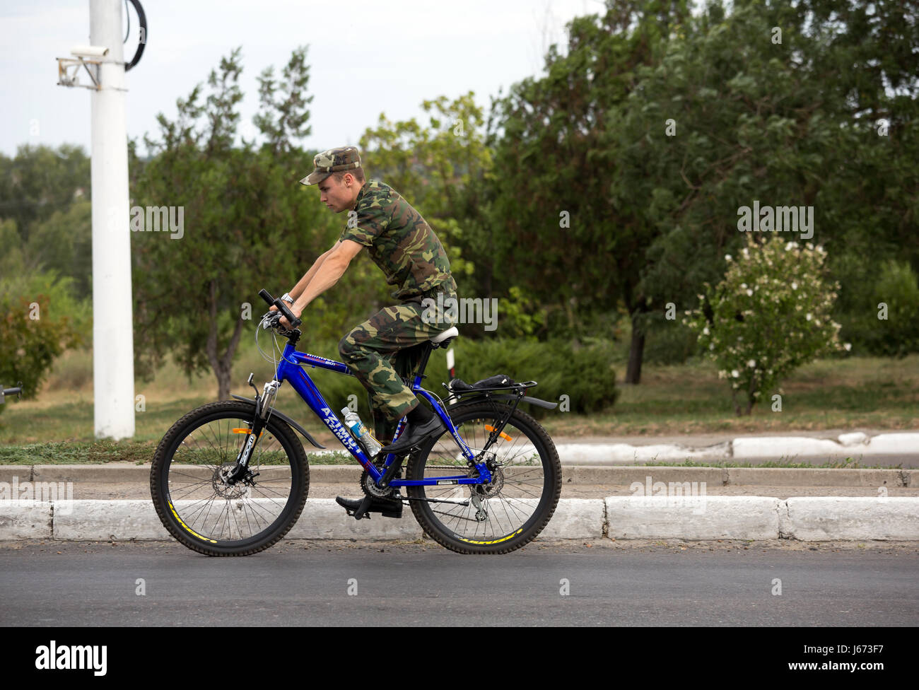 Bender, Moldova, soldier on bicycle Stock Photo