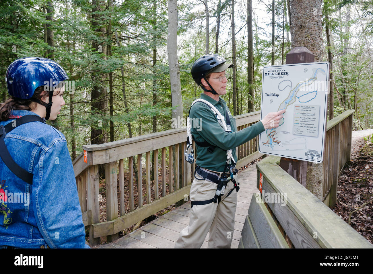 Michigan Mackinaw City,Mackinac State historic Parks Park,historic Mill Creek Discovery Park,Forest Canopy Bridge,safety equipment,helmet,naturalist,m Stock Photo