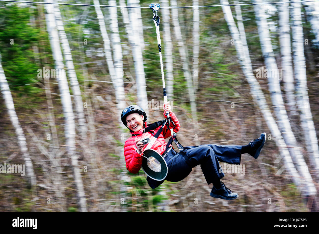 Michigan Mackinaw City,Mackinac State historic Parks Park,historic Mill Creek Discovery Park,zip line,safety harness,helmet,sliding,aerial ropeslide,g Stock Photo