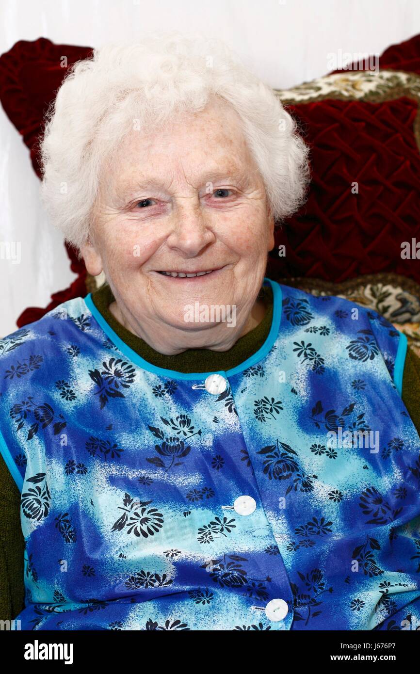 grandma smiles in the living room Stock Photo - Alamy