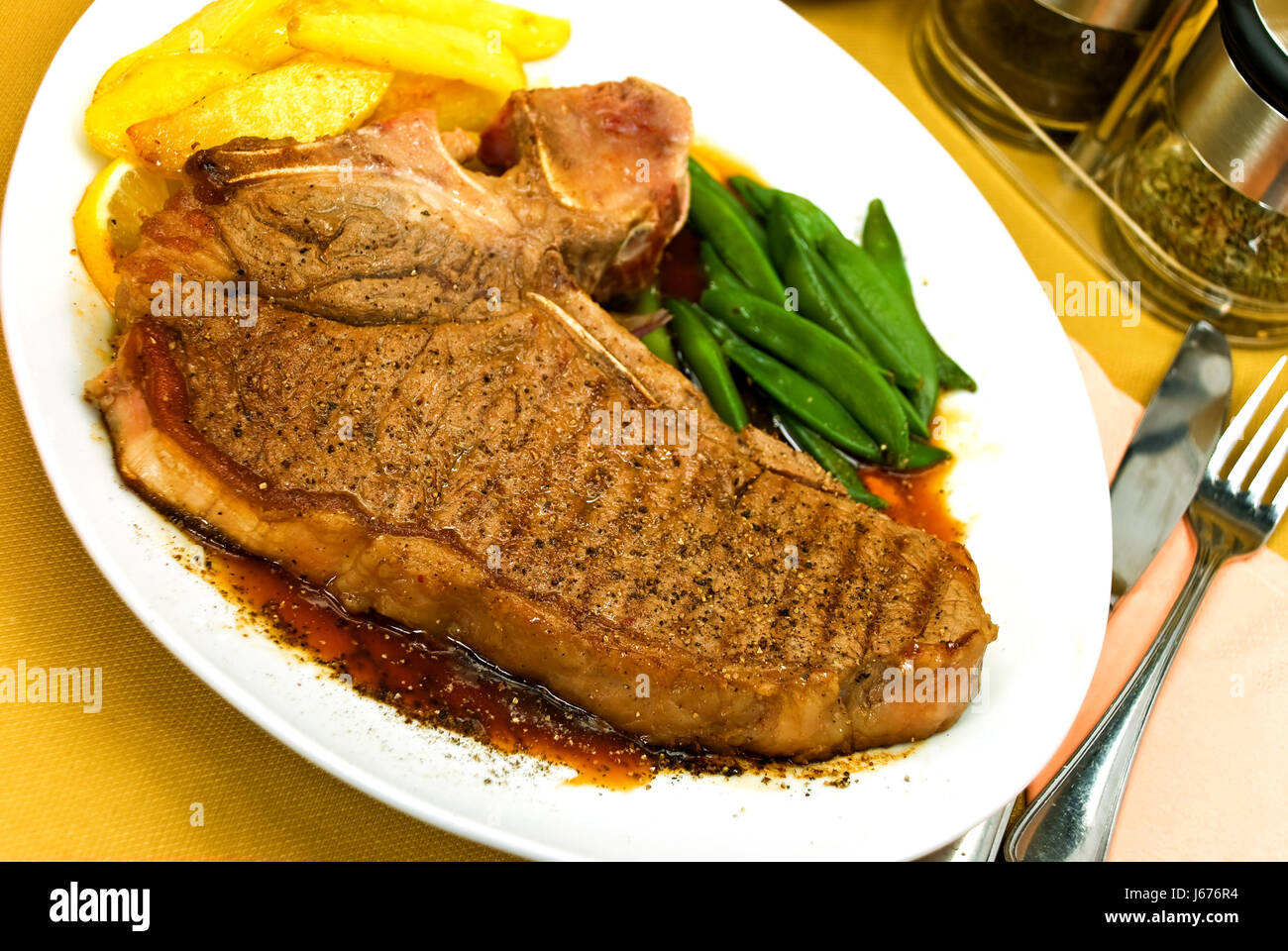 tbone steak with potatoes,gr. beans Stock Photo Alamy