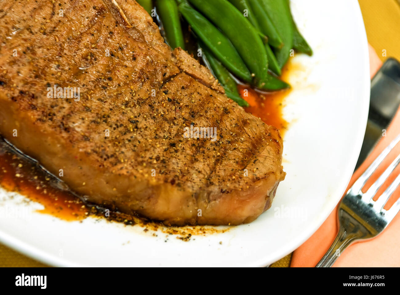 tbone steak with potatoes,gr. beans Stock Photo Alamy