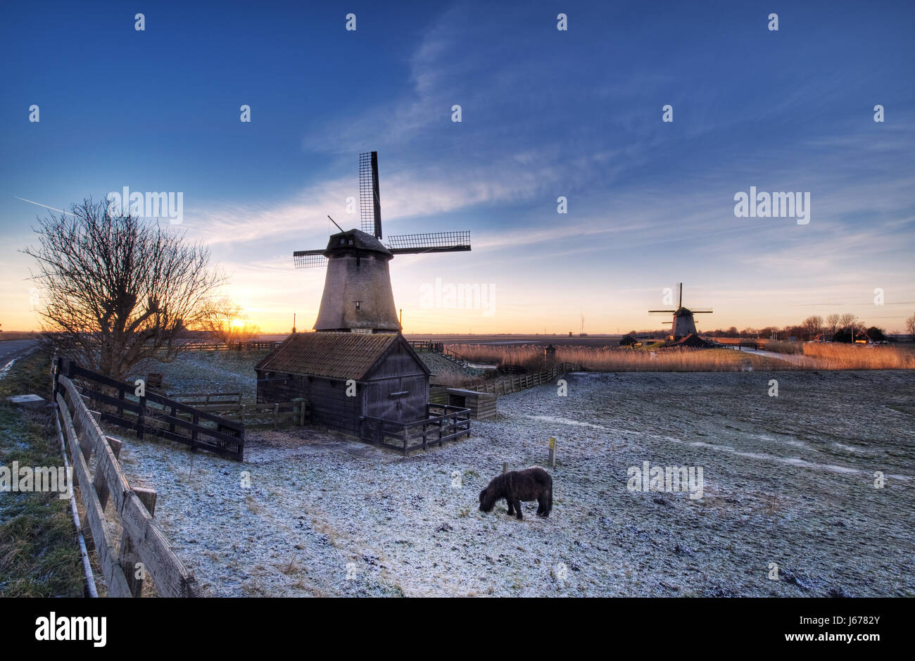 winter sunset holland netherlands windmill style of construction architecture Stock Photo