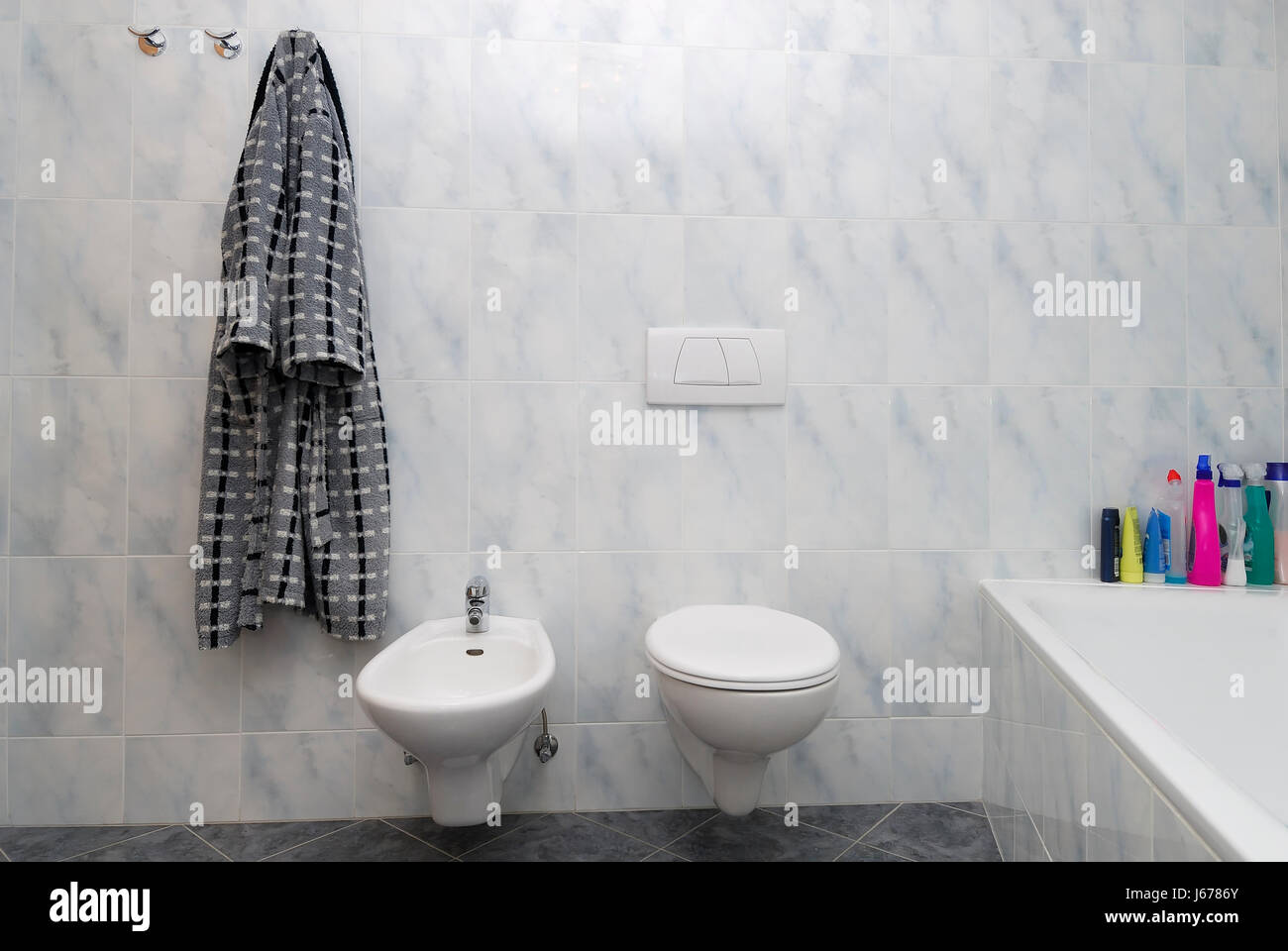 flow ceramic tiles toilet washroom bidet bathroom flow ceramic tiles bathrobe Stock Photo