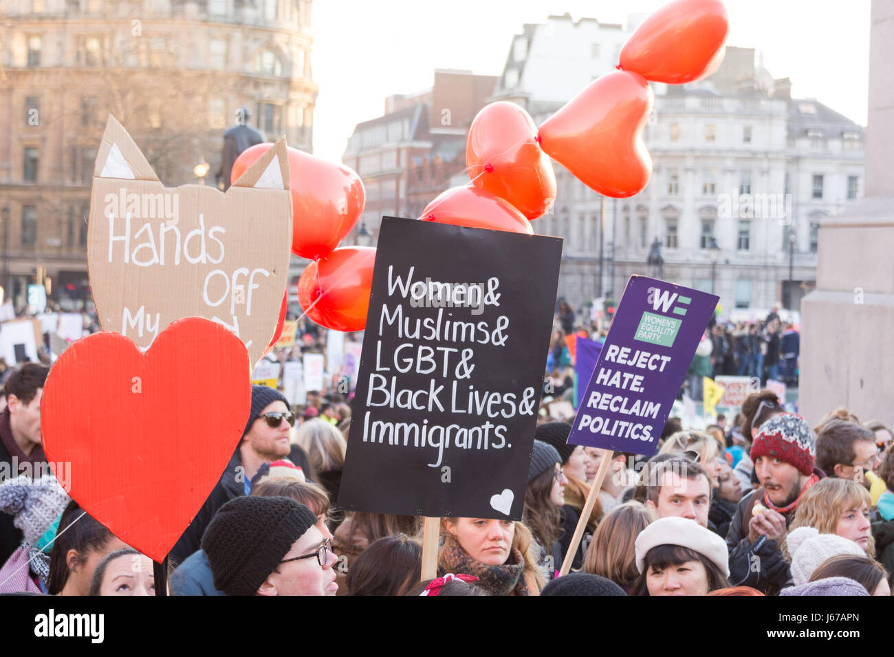 Women's March against Trump, placard women, muslim, LGBT, black lives, immigrants Stock Photo