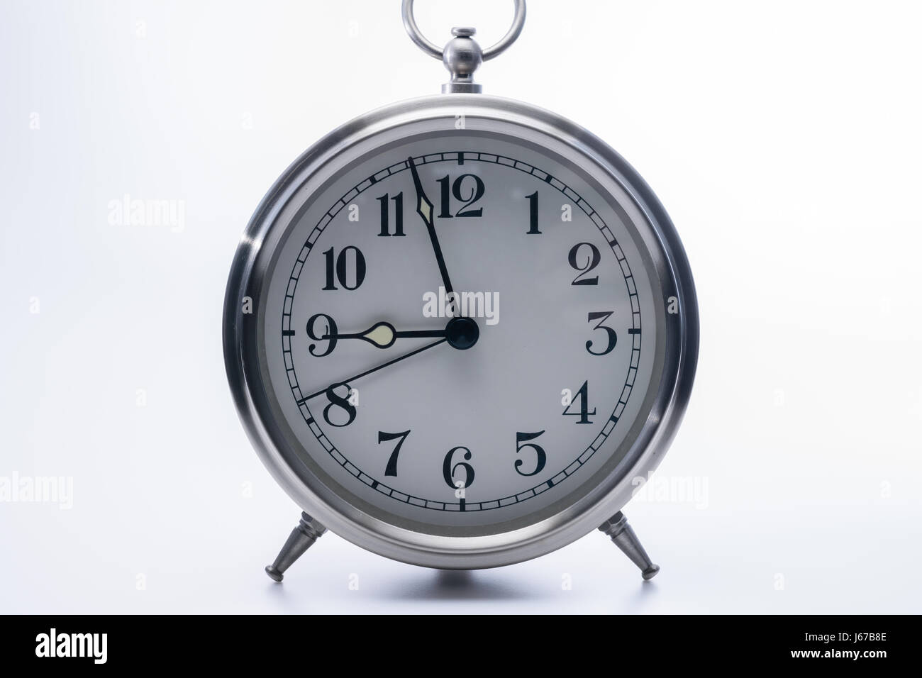 Vintage clock isolated on white background Stock Photo - Alamy