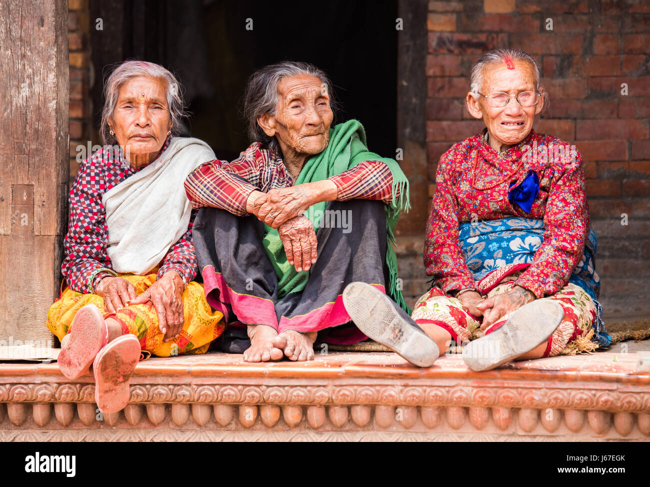 Kathmandu, Nepal Apr 15, 2016 Elderly ladies in traditional Nepalese clothing watching a
