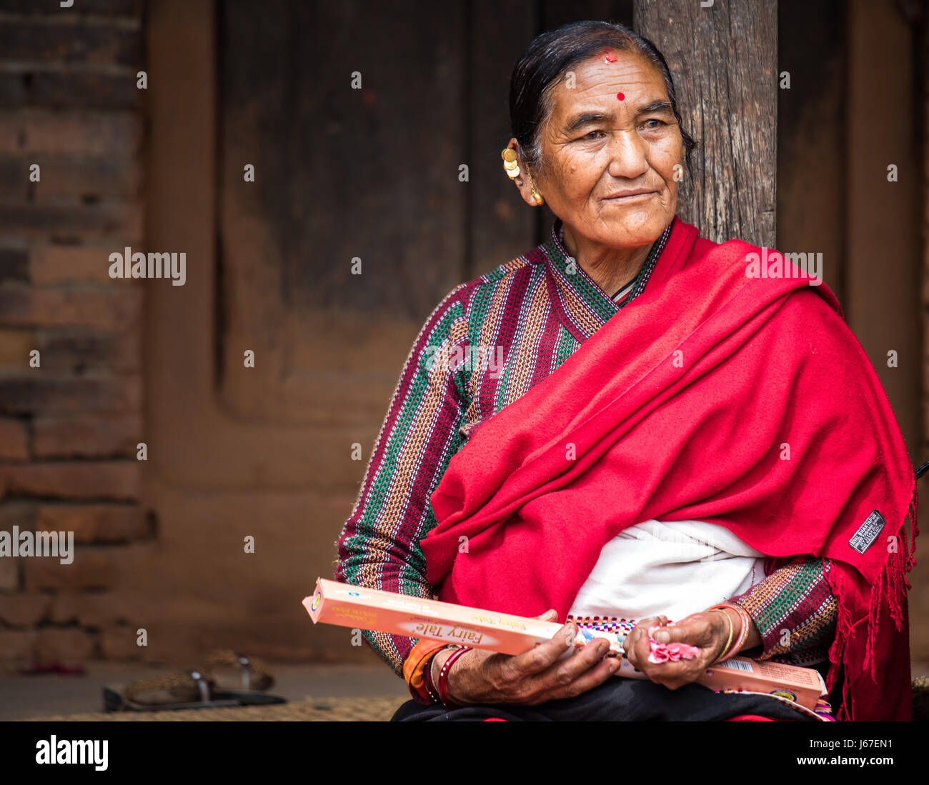 Kathmandu, Nepal Apr 15, 2016 Elderly ladies in traditional Nepalese clothing watching a
