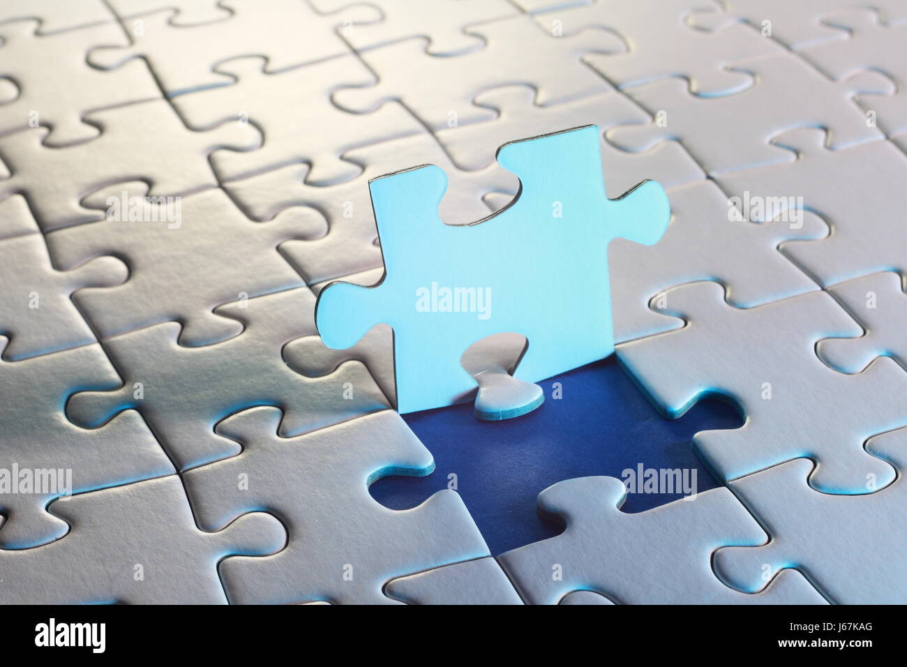 Teamwork symbolized by jigsaw-puzzle Stock Photo