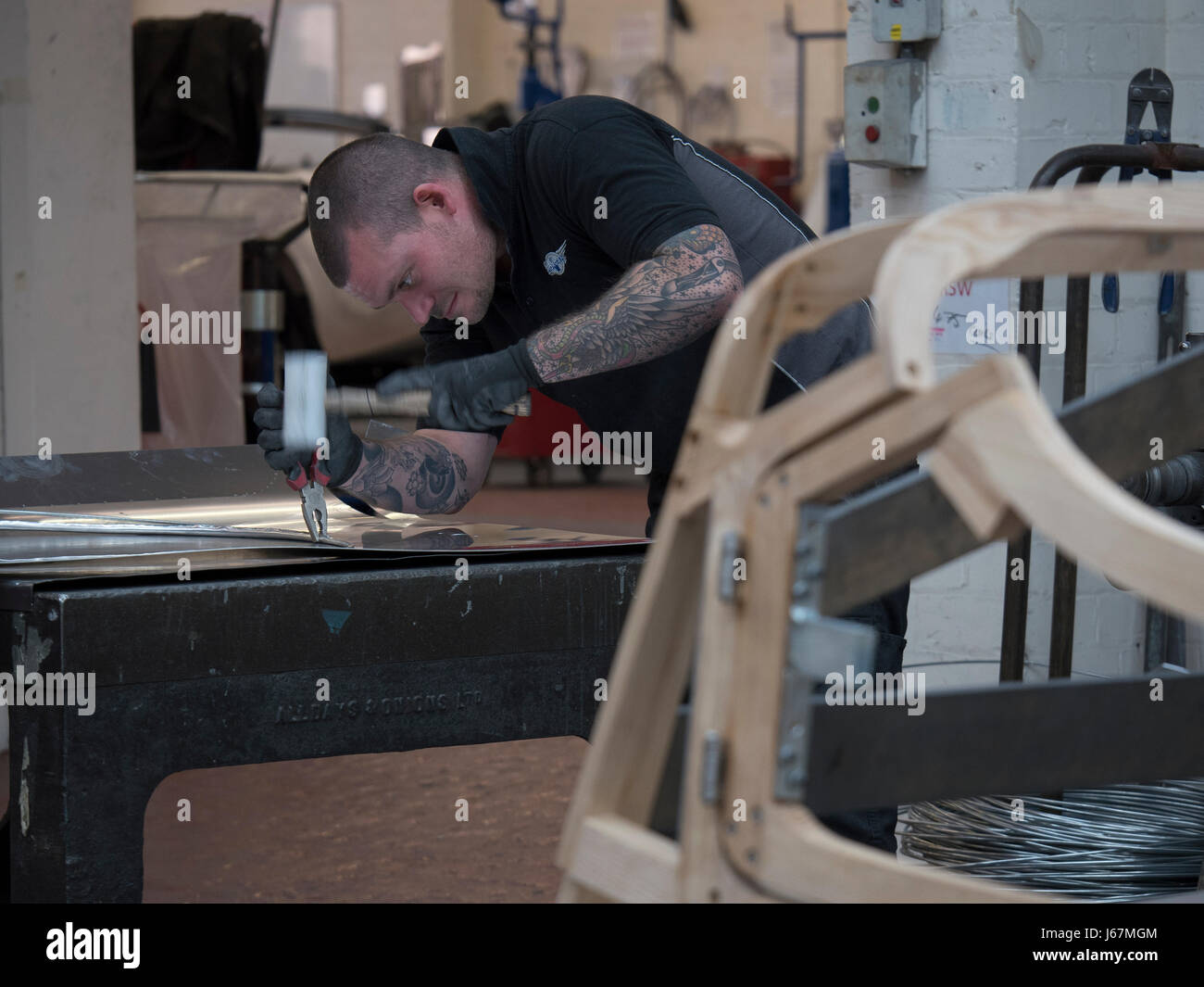 Workers at the Morgan Motor Co. factory in Malvern, England hand build ...