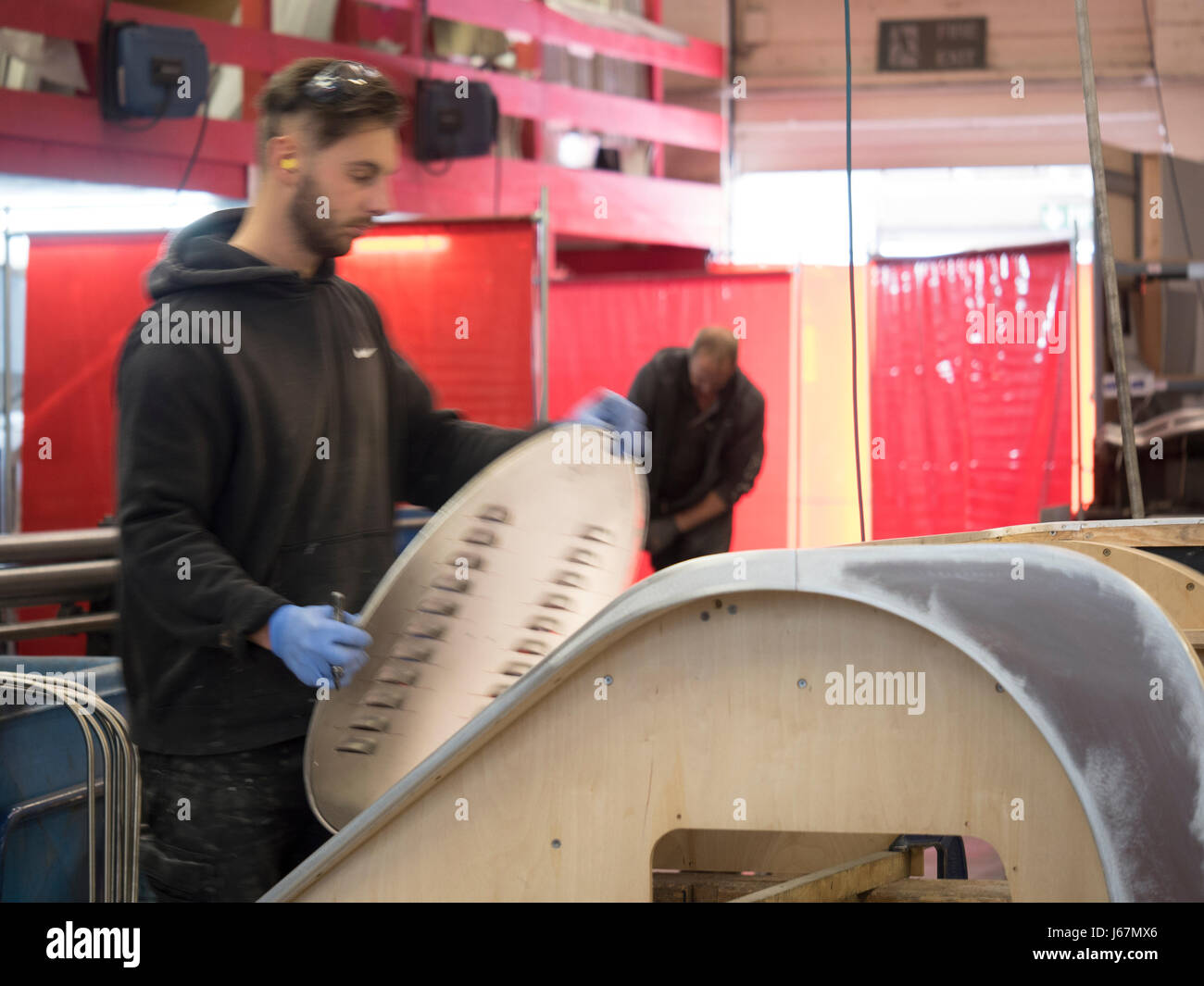 Workers at the Morgan Motor Co. factory in Malvern, England hand build ...