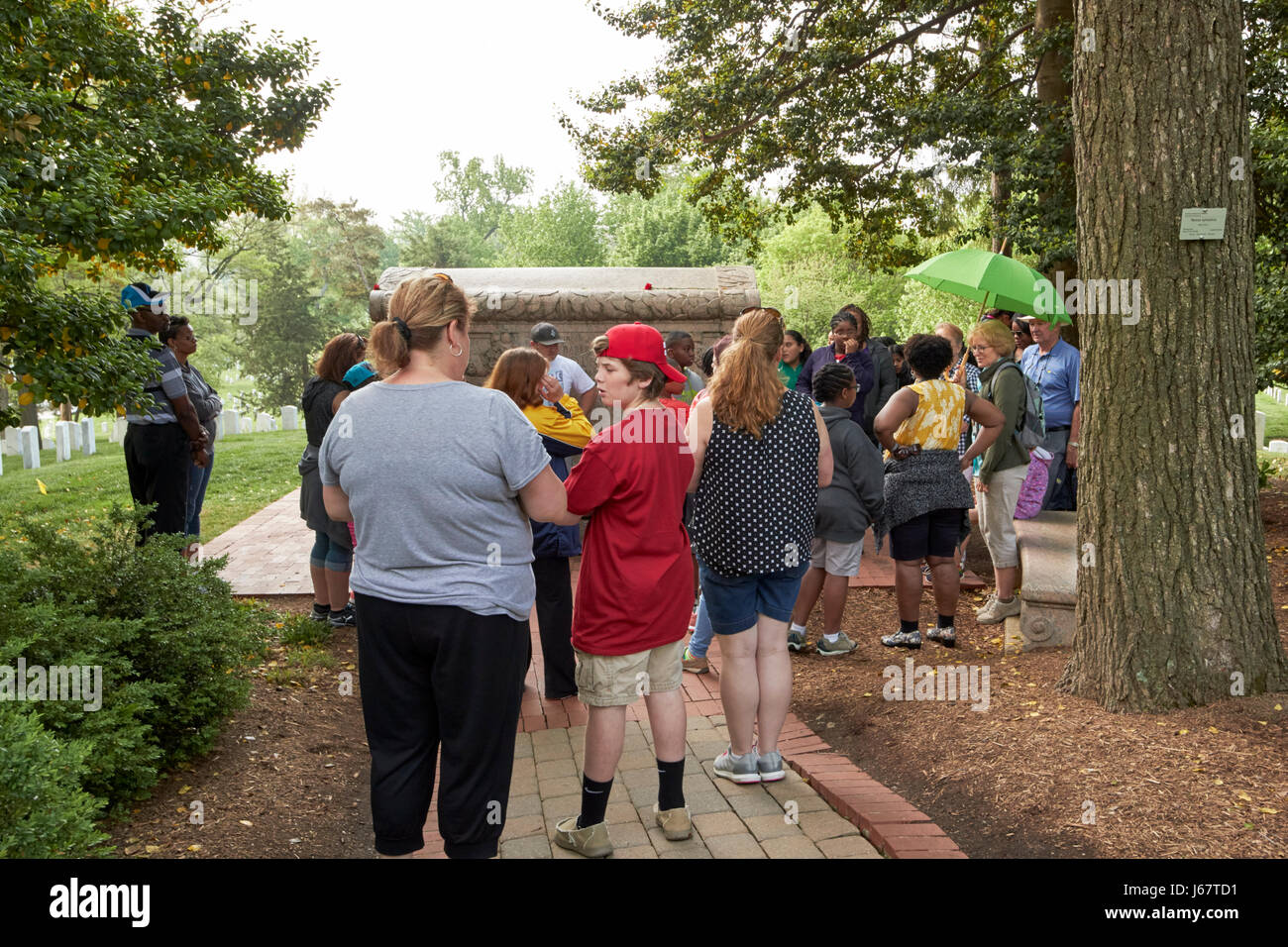 tourists on guided tour of arlington cemetery Washington DC USA Stock Photo