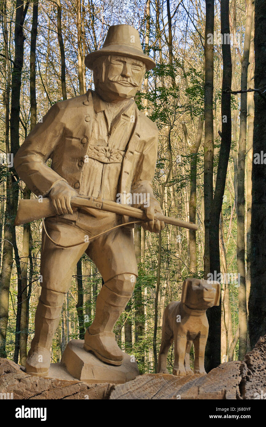 hunter and dog wood carving Stock Photo Alamy