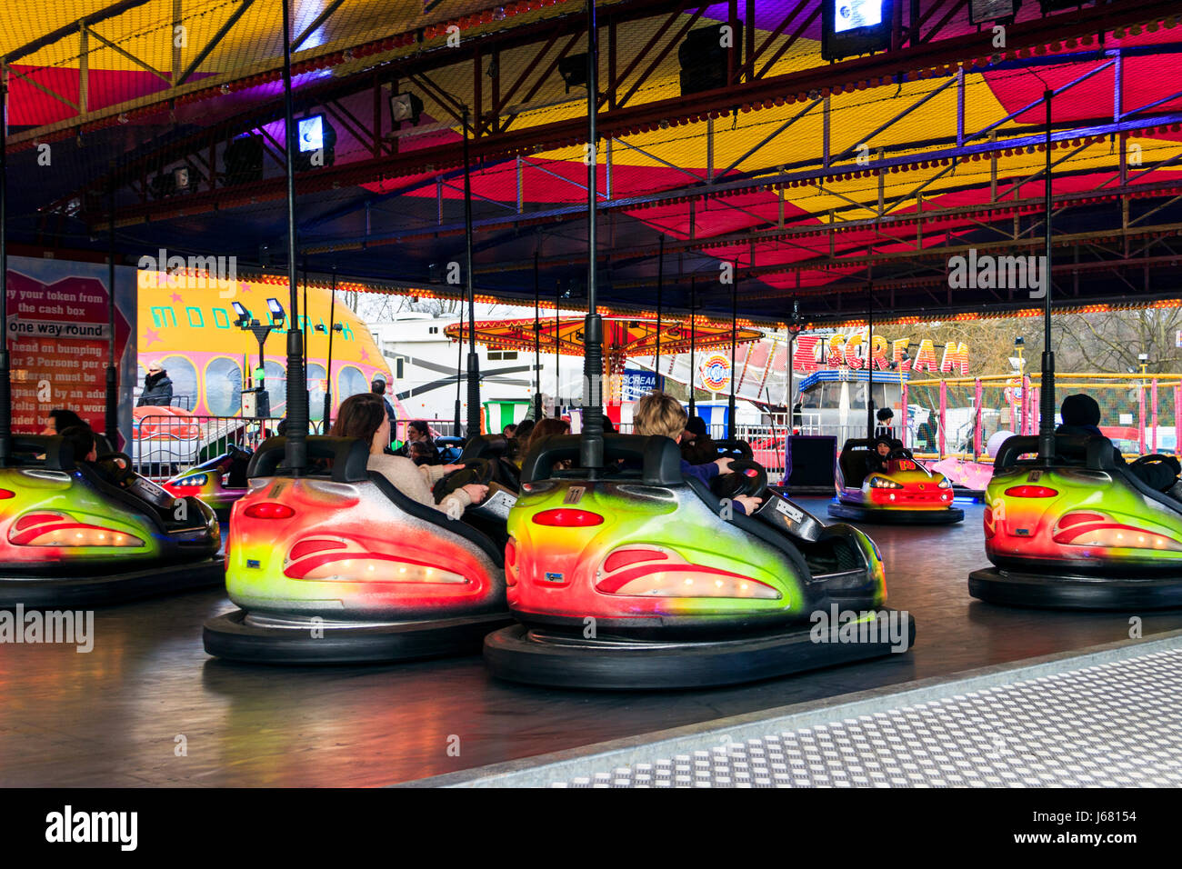 Multicoloured dodgems or bumper cars at a bank holiday funfair, London, UK Stock Photo