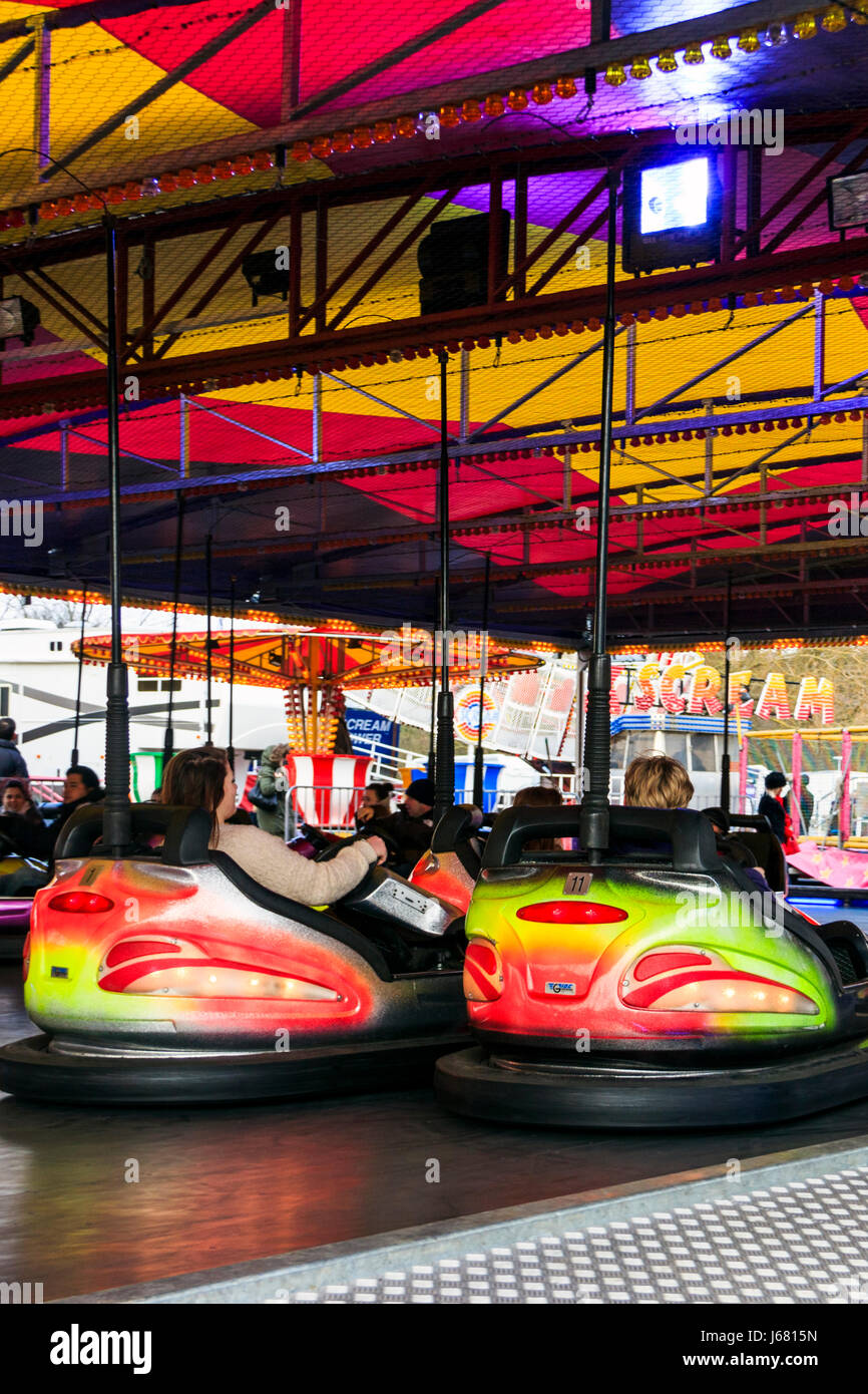 Multicoloured dodgems or bumper cars at a bank holiday funfair, London, UK Stock Photo