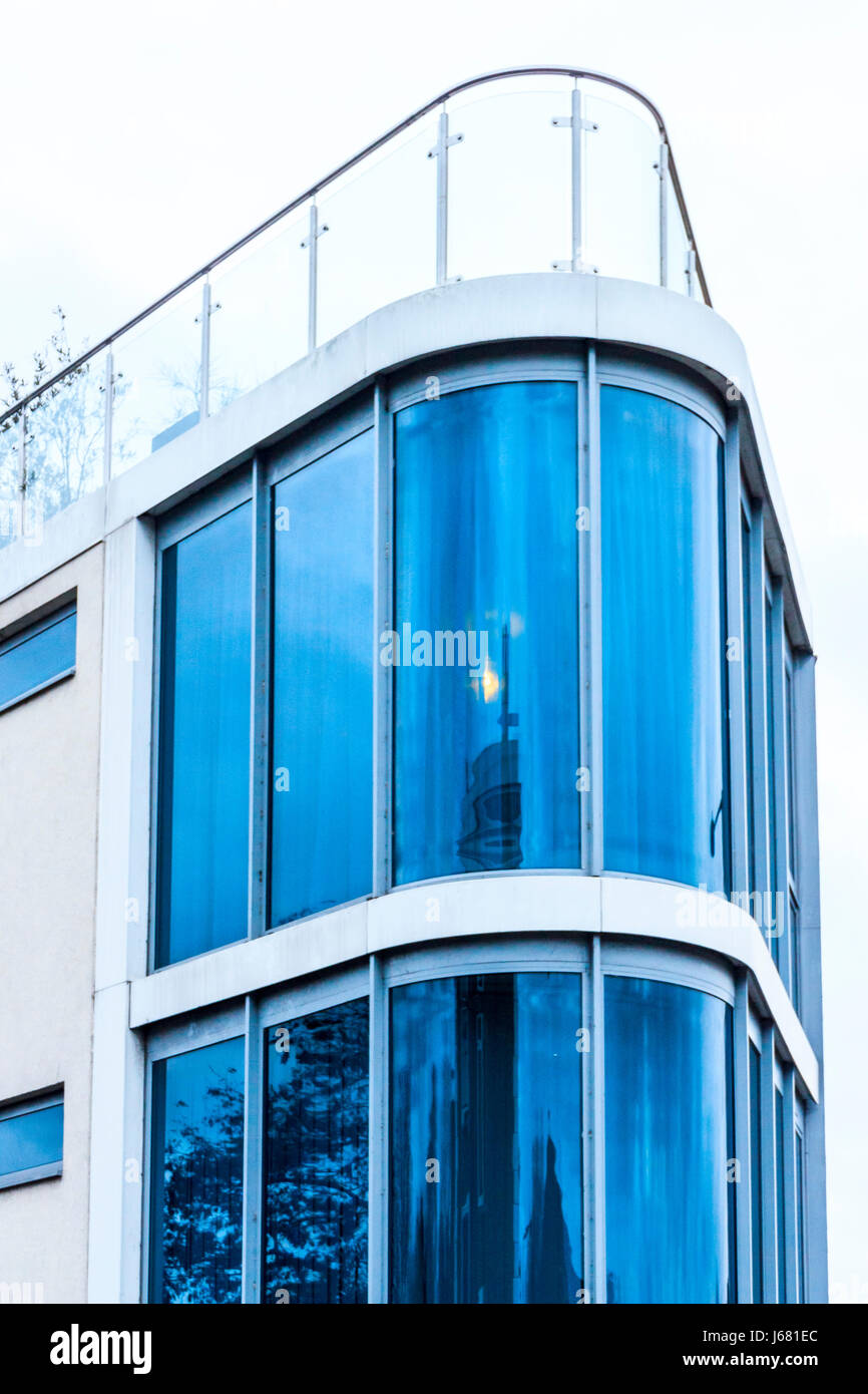 Reflection of building  in curved window, St Pancras Way, London, UK Stock Photo