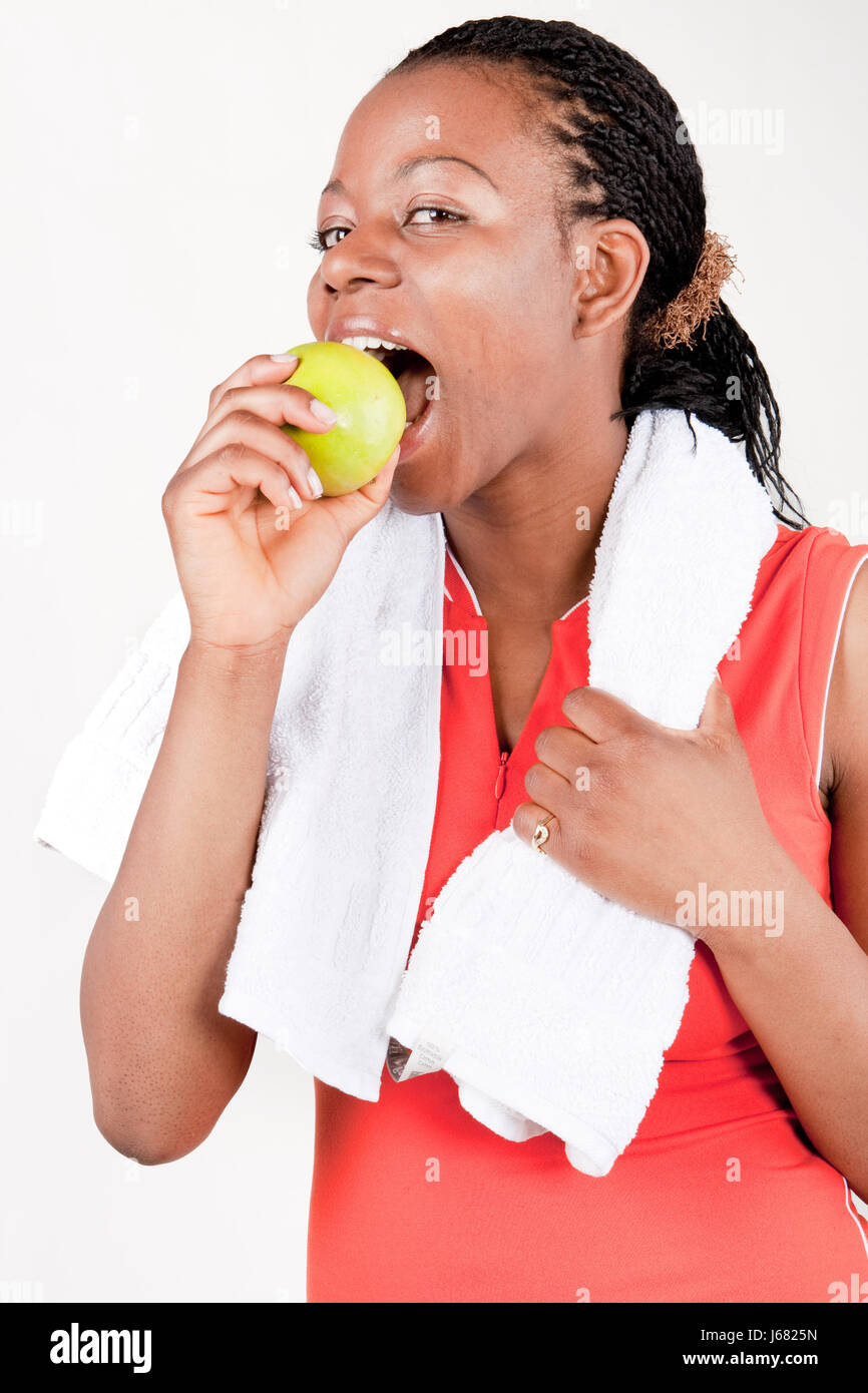 woman biting into apple Stock Photo