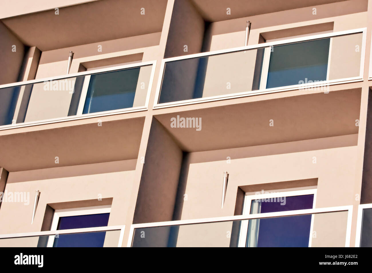 hotel rooms windows window building blue house building glass chalice tumbler Stock Photo