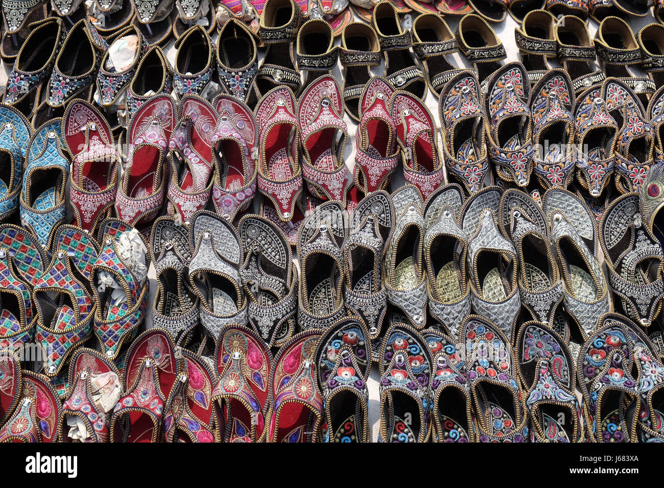 Display of traditional shoes at the street market in Jaipur. Jaipur is the capital and the biggest city of Rajasthan, India Stock Photo
