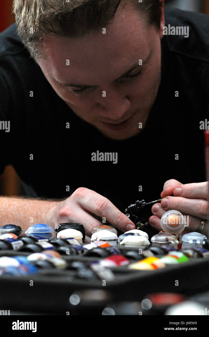 A hobbyist paints a model for a tabletop wargame Stock Photo Alamy