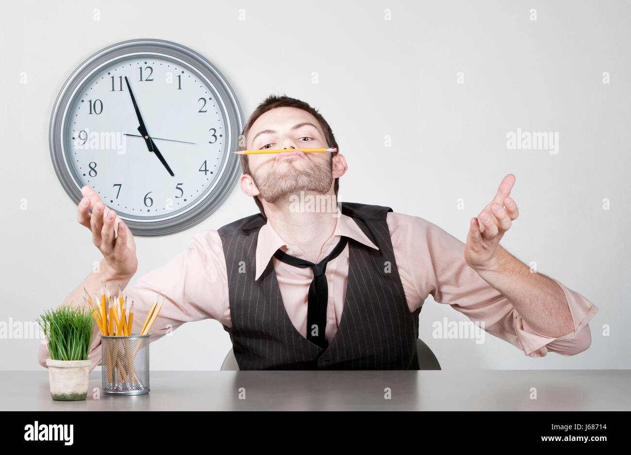 work bored clock time job desk pencil young work bored clock time job