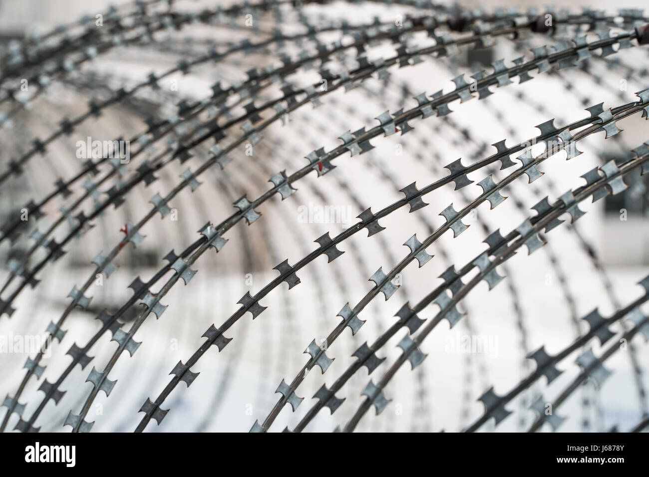 Barbed wire fence against the blue sky Stock Photo - Alamy