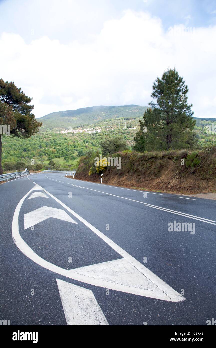 sign signal spain asphalt motorway highway paint curve road street roadway Stock Photo
