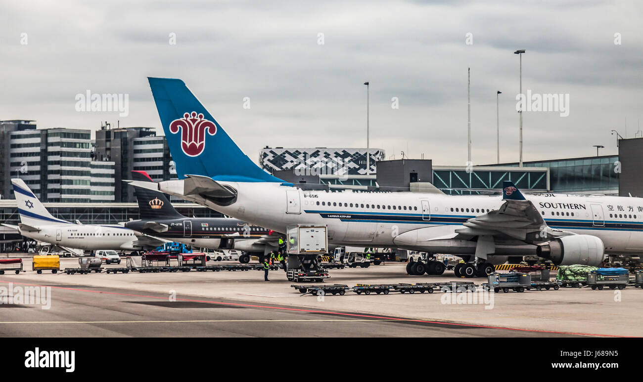 China Southern Airbus A330-200 B-6515 parked at Schiphol Airport, Amsterdam, The Netherlands. Tail logos of Royal Jordanian Airlines and El Al Stock Photo