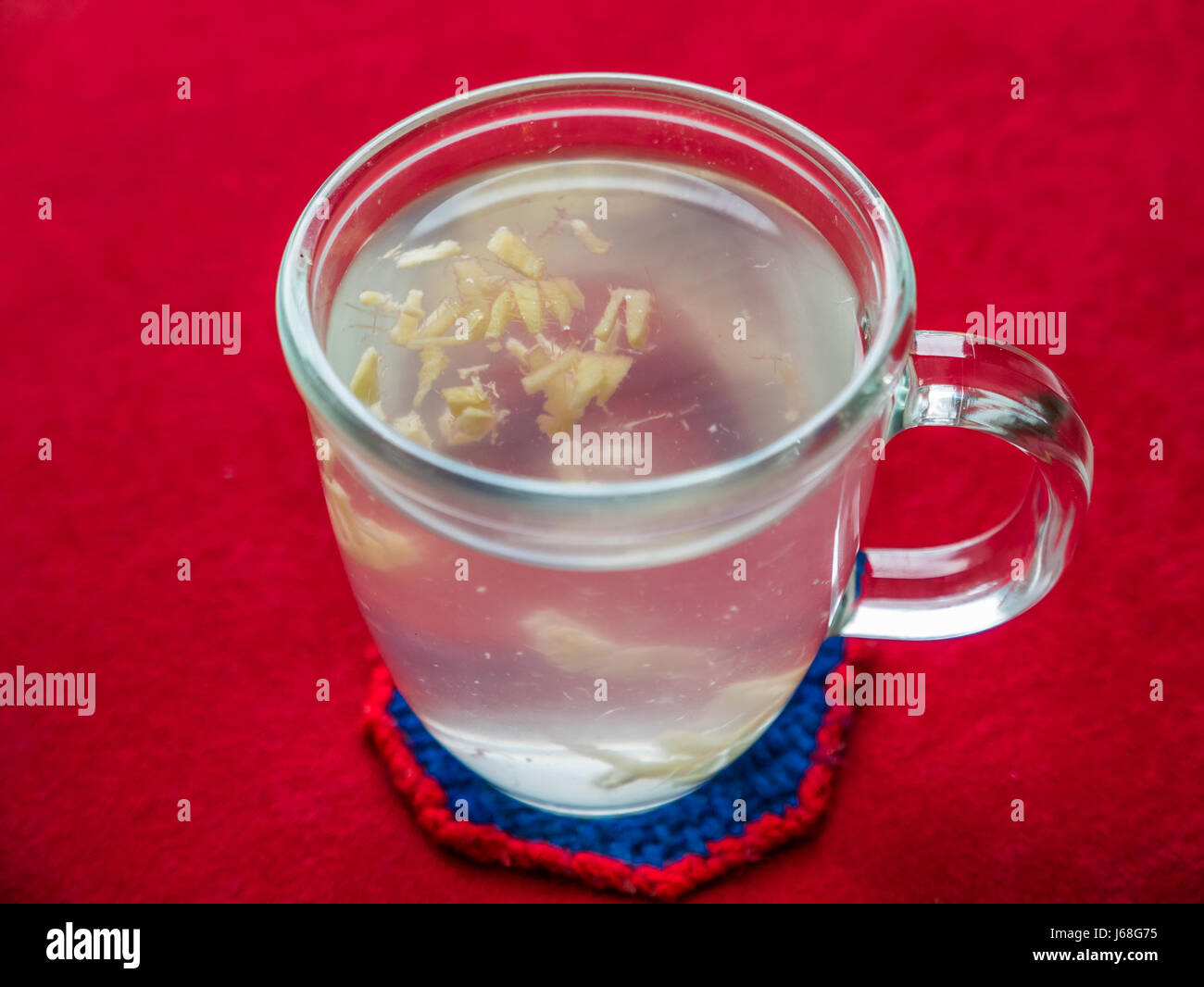 Hot ginger drink made of fresh cut up ginger root Stock Photo Alamy