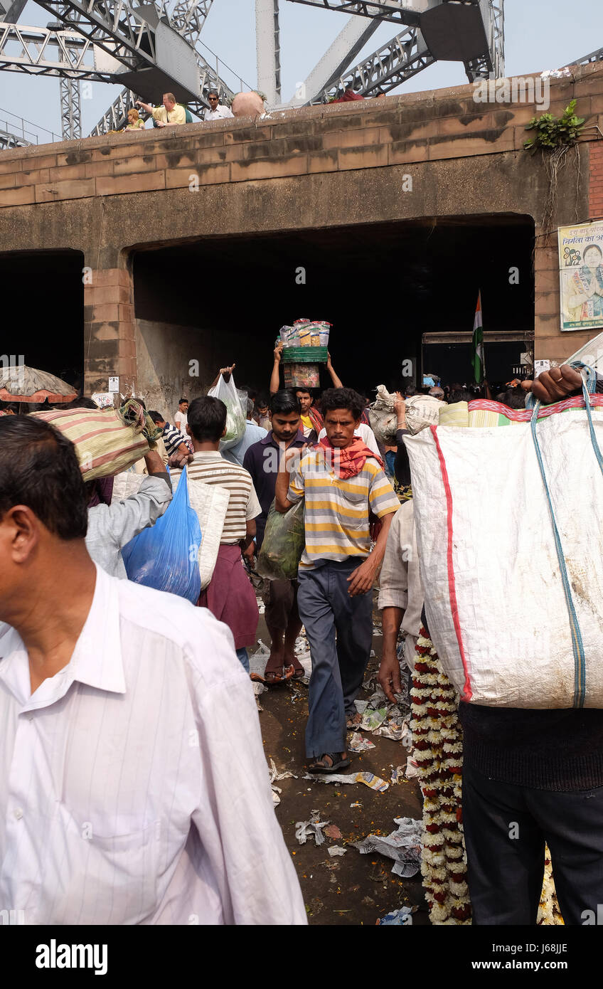 People buying and selling flowers and garlands at the flower market in Kolkata on February 10, 2016. Stock Photo