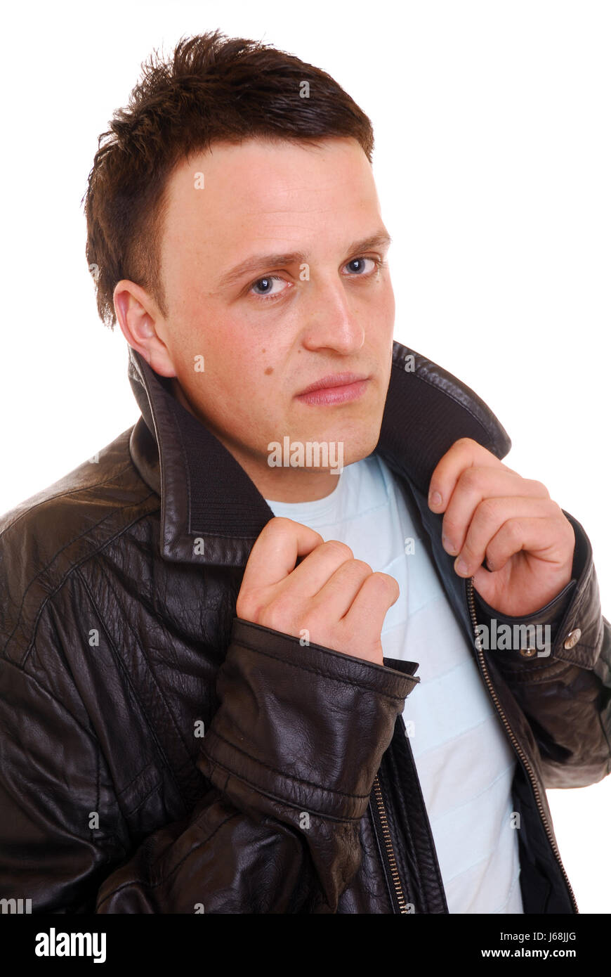 leather jacket arrogant young younger man studio photography brown brownish Stock Photo