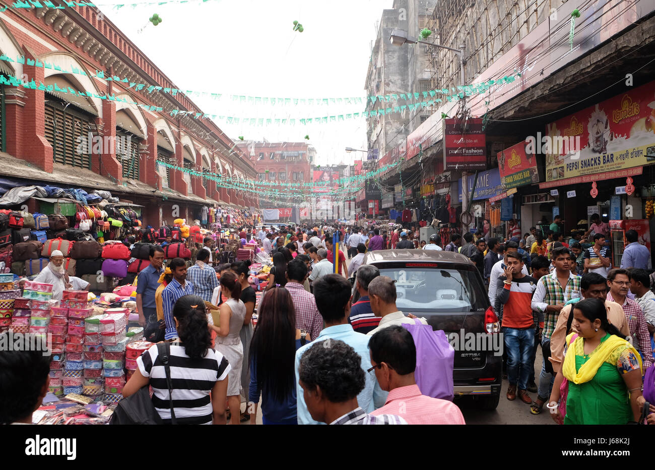 Crowded pedestrian shopping area near New Market in Kolkata, India on