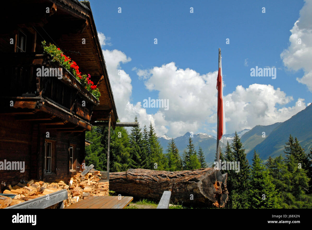 alps alp blockhouse mountain house building mountains wood national park trunk Stock Photo