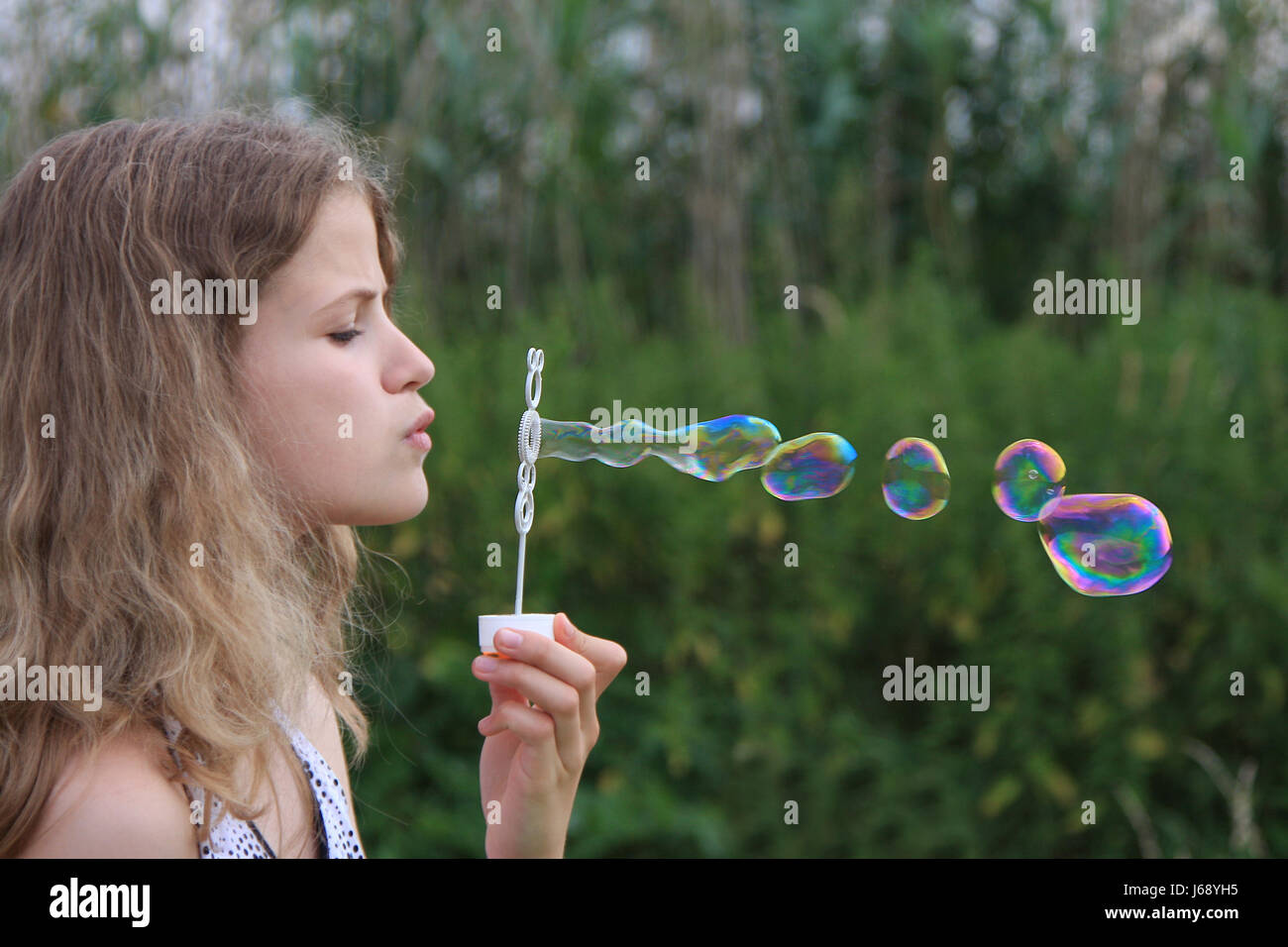 child blowing bubbles Stock Photo - Alamy