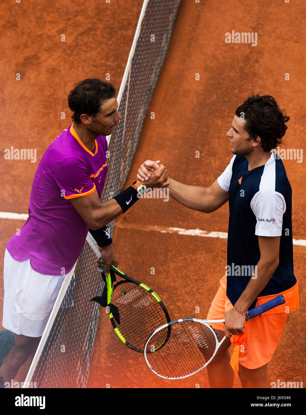 Rome, Italy. 19th May, 2017. Rafael Nadal (L) of Spain shakes hands with  Dominic Thiem of Austria during the quarterfinal match of men's singles at  the Italian Open tennis tournament in Rome,